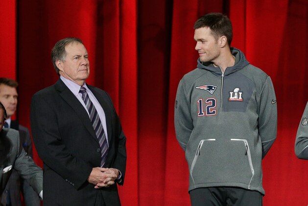 HOUSTON, TX - JANUARY 30:  Head coach Bill Belichick of the New England Patriots and Tom Brady #12 stand onstage during Super Bowl 51 Opening Night at Minute Maid Park on January 30, 2017 in Houston, Texas.  (Photo by Bob Levey/Getty Images)