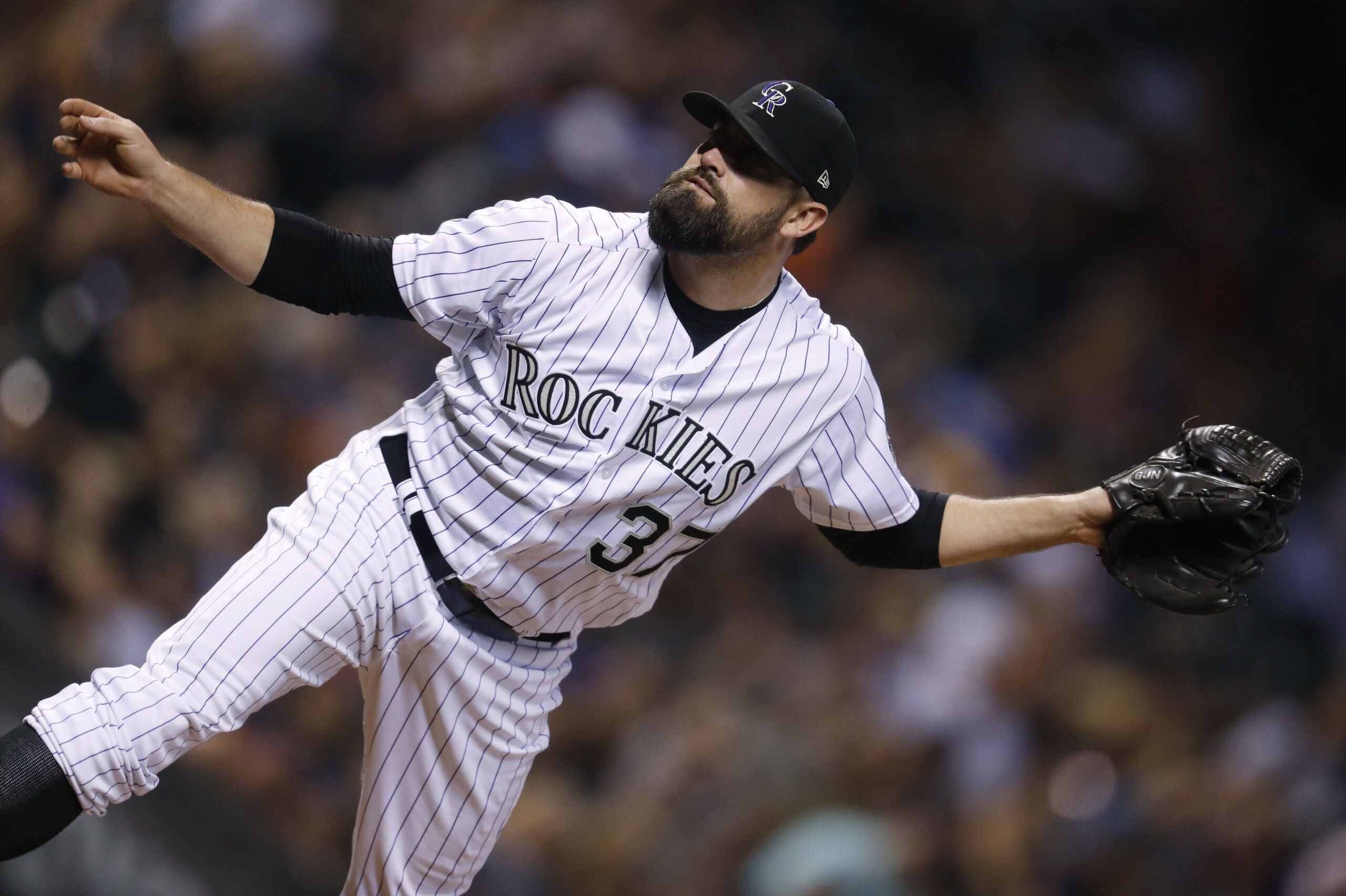 Colorado Rockies reliever Pat Neshek watches a pitch to Arizona Diamondbacks' J.D. Martinez during the seventh inning of a baseball game Saturday, Sept. 2, 2017, in Denver. The Diamondbacks won 6-2. (AP Photo/David Zalubowski)