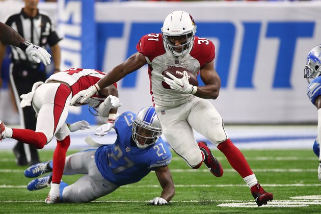 DETROIT, MI - SEPTEMBER 10: David Johnson #31 of the Arizona Cardinals escapes the tackle of Glover Quin #27 of the Detroit Lions during a second half run at Ford Field on September 10, 2017 in Detroit, Michigan. (Photo by Gregory Shamus/Getty Images)