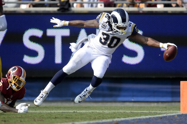 September 17, 2017; Los Angeles, CA, USA; Los Angeles Rams running back Todd Gurley (30) scores a touchdown against the Washington Redskins during the second half at Los Angeles Memorial Coliseum. Mandatory Credit: Gary A. Vasquez-USA TODAY Sports