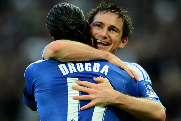 LONDON, ENGLAND - APRIL 15:  Frank Lampard of Chelsea celebrates with Didier Drogba as he scores their fourth goal from a free kick during the FA Cup with Budweiser Semi Final match between Tottenham Hotspur and Chelsea at Wembley Stadium on April 15, 2012 in London, England.  (Photo by Mike Hewitt/Getty Images)