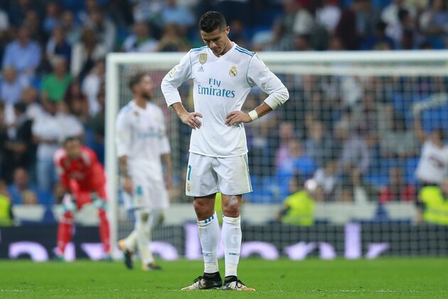 MADRID, SPAIN - SEPTEMBER 20:  Cristiano Ronaldo of Real Madrid CF recats as Real Betis Balompie players celebrate their first goal during the La Liga match between Real Madrid CF and Real Betis Balompie at Estadio Santiago Bernabeu on September 20, 2017 in Madrid, Spain.  (Photo by Gonzalo Arroyo Moreno/Getty Images)