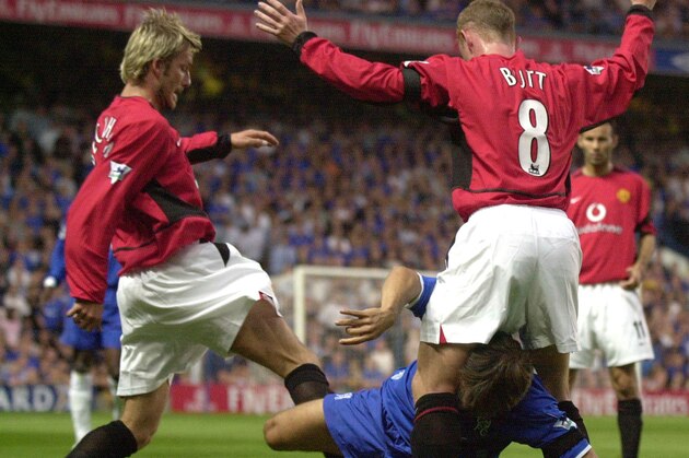 Manchester United's David Beckham, left, and Nicky Butt, right,  in action against Chelsea's Gianfranco Zola, centre, during their FA Premier League soccer match played at the Stamford Bridge stadium in London, Friday, Aug. 23, 2002. (AP Photo/Richard Lewis) ** Internet Out Online Out **
