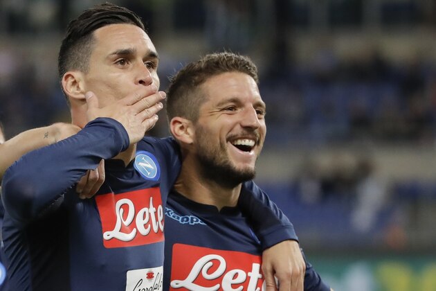 Napoli's Jose Callejon, left, celebrates with his teammate Dries Mertens after scoring during a Serie A soccer match between Lazio and Napoli, at the Rome Olympic stadium, Wednesday, Sept. 20, 2017. (AP Photo/Alessandra Tarantino)