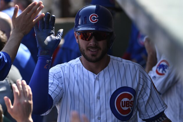 CHICAGO, IL - SEPTEMBER 15: Kris Bryant #17 of the Chicago Cubs is greeted by his teammates after hitting a home run against the St. Louis Cardinals during the fourth inning on September 15, 2017 at Wrigley Field  in Chicago, Illinois. (Photo by David Banks/Getty Images)
