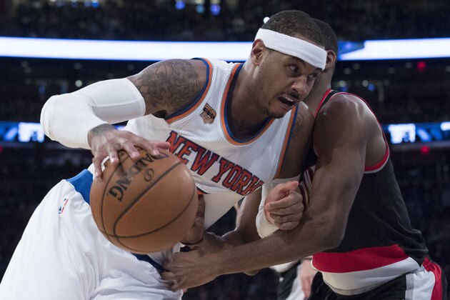 New York Knicks forward Carmelo Anthony, left, drives against Portland Trail Blazers forward Maurice Harkless during the second half of an NBA basketball game, Tuesday, Nov. 22, 2016, at Madison Square Garden in New York. The Knicks won 107-103. (AP Photo/Mary Altaffer)
