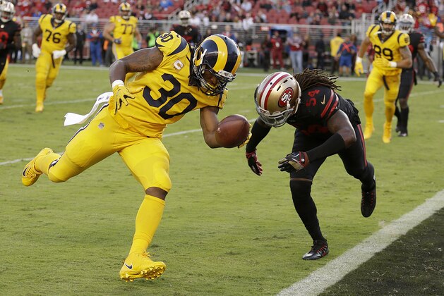 Los Angeles Rams running back Todd Gurley (30) scores a touchdown in front of San Francisco 49ers outside linebacker Ray-Ray Armstrong (54) during the first half of an NFL football game in Santa Clara, Calif., Thursday, Sept. 21, 2017. (AP Photo/Ben Margot)