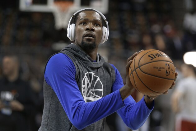 Golden State Warriors forward Kevin Durant warms up before Game 4 of the basketball team's NBA Finals against the Cleveland Cavaliers in Cleveland, Friday, June 9, 2017. (AP Photo/Tony Dejak)
