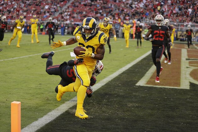 Los Angeles Rams running back Todd Gurley (30) scores a touchdown in front of San Francisco 49ers outside linebacker Ray-Ray Armstrong during the first half of an NFL football game in Santa Clara, Calif., Thursday, Sept. 21, 2017. (AP Photo/Ben Margot)