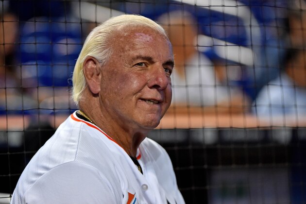 Jul 28, 2017; Miami, FL, USA; Former wrestling WCW and WWE wrestler Ric Flair warms up before throwing out the first pitch at Marlins Park prior to the game between the Cincinnati Reds and the Miami Marlins. Mandatory Credit: Jasen Vinlove-USA TODAY Sports