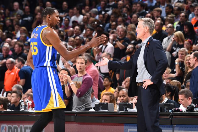 CLEVELAND, OH - JUNE 9:  Kevin Durant #35 and head coach Steve Kerr of the Golden State Warriors high-five in Game Four of the 2017 NBA Finals on June 9, 2017 at Quicken Loans Arena in Cleveland, Ohio. NOTE TO USER: User expressly acknowledges and agrees that, by downloading and/or using this photograph, user is consenting to the terms and conditions of Getty Images License Agreement. Mandatory Copyright Notice: Copyright 2017 NBAE (Photo by Andrew D. Bernstein/NBAE via Getty Images)
