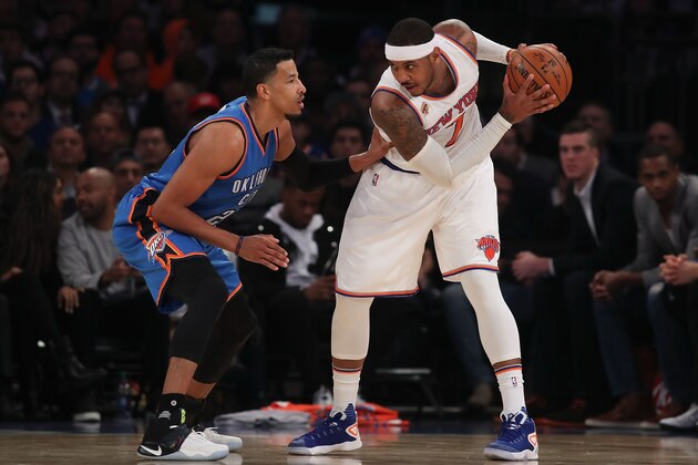 NEW YORK, NY - NOVEMBER 28:  Carmelo Anthony #7 of the New York Knicks looks to pass around Andre Roberson #21 of the Oklahoma City Thunder during the second half at Madison Square Garden on November 28, 2016 in New York City. NOTE TO USER: User expressly acknowledges and agrees that, by downloading and or using this photograph, User is consenting to the terms and conditions of the Getty Images License Agreement.  (Photo by Michael Reaves/Getty Images)