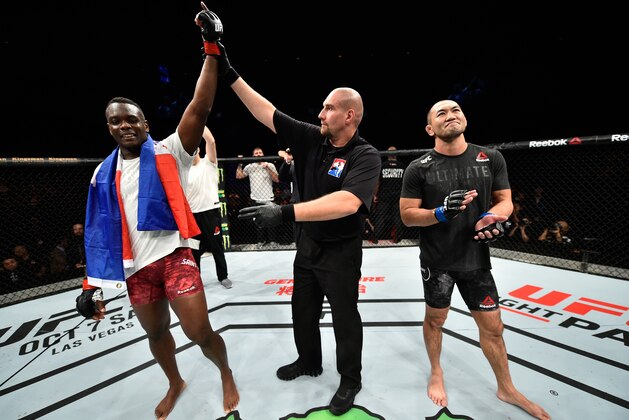 SAITAMA, JAPAN - SEPTEMBER 22:  (L-R) Ovince Saint Preux celebrates his submission victory over Yushin Okami of Japan in their light heavyweight bout during the UFC Fight Night event inside the Saitama Super Arena on September 22, 2017 in Saitama, Japan. (Photo by Jeff Bottari/Zuffa LLC/Zuffa LLC via Getty Images)