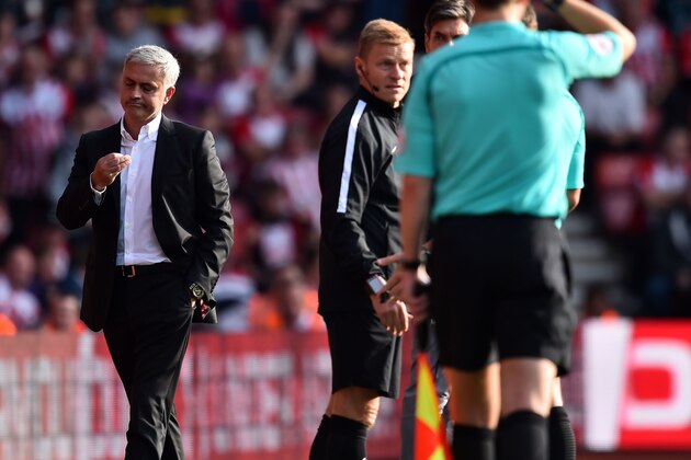 Manchester United's Portuguese manager Jose Mourinho (L) gestures after being sent to the stands by referee Craig Pawson during the English Premier League football match between Southampton and Manchester United at St Mary's Stadium in Southampton, southern England on September 23, 2017.
Manchester United won the game 1-0. / AFP PHOTO / Glyn KIRK / RESTRICTED TO EDITORIAL USE. No use with unauthorized audio, video, data, fixture lists, club/league logos or 'live' services. Online in-match use limited to 75 images, no video emulation. No use in betting, games or single club/league/player publications.  /         (Photo credit should read GLYN KIRK/AFP/Getty Images)