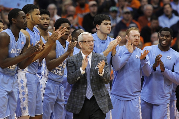 FILE - In this Jan. 9, 2016, file photo, North Carolina head coach Roy Williams claps with players on the bench during the second half of an NCAA college basketball game against Syracuse in Syracuse, N.Y. No. 2 North Carolina is the only unbeaten team in the Atlantic Coast Conference after a favorable opening month of the league schedule. The Tar Heels on Saturday play Boston College, which is 0-7 in the league. Then things get tougher.  (AP Photo/Nick Lisi, File)