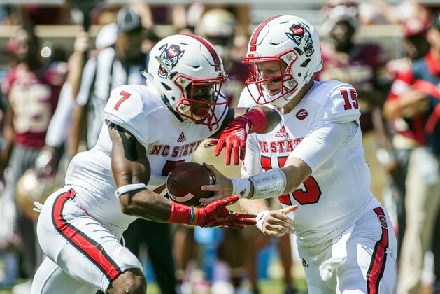 North Carolina State quarterback Ryan Finley (15) hands off to running back Nyheim Hines during the first half of an NCAA college football game against Florida State in Tallahassee, Fla., Saturday, Sept. 23, 2017. (AP Photo/Mark Wallheiser)