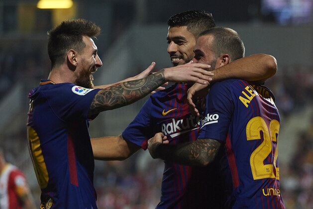 GIRONA, SPAIN - SEPTEMBER 23:  Luis Suarez of Barcelona celebrates scoring his team's second goal with his teammates Aleix Vidal (R) and Lionel Messi (L) during the La Liga match between Girona and Barcelona at Municipal de Montilivi Stadium on September 23, 2017 in Girona, Spain.  (Photo by Manuel Queimadelos Alonso/Getty Images)