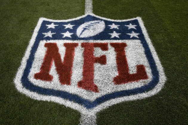 The NFL logo is shown at mid field prior to an NFL preseason football game between the Denver Broncos and the Arizona Cardinals, Thursday, Aug. 31, 2017, in Denver. (AP Photo/Jack Dempsey)