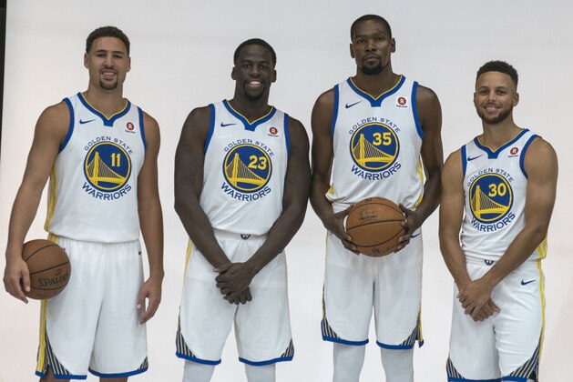 September 22, 2017; Oakland, CA, USA; Golden State Warriors guard Klay Thompson (11), forward Draymond Green (23), forward Kevin Durant (35), and guard Stephen Curry (30) during media day at Rakuten Performance Center. Mandatory Credit: Kyle Terada-USA TODAY Sports