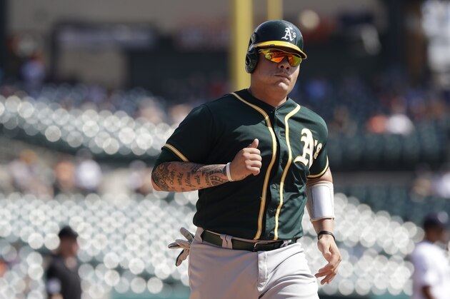 Oakland Athletics' Bruce Maxwell scores during the third inning of a baseball game against the Detroit Tigers, Wednesday, Sept. 20, 2017, in Detroit. (AP Photo/Carlos Osorio)