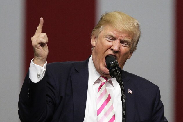 FILE - In this Sept. 22, 2017 file photo, President Donald Trump speaks at a campaign rally in support of Sen. Luther Strange, in Huntsville, Ala. Asia is getting used to living with Trump’s broadsides, though it can’t shrug them off completely. Many people were unnerved, but not panicked, by his latest exchange of threats with North Korean leader Kim Jong Un after the U.S. president said at the United Nations that his country would have “to totally destroy North Korea” if forced to defend itself or its allies. (AP Photo/Brynn Anderson, File)