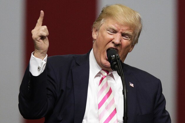FILE - In this Sept. 22, 2017 file photo, President Donald Trump speaks at a campaign rally in support of Sen. Luther Strange, in Huntsville, Ala. Asia is getting used to living with Trump’s broadsides, though it can’t shrug them off completely. Many people were unnerved, but not panicked, by his latest exchange of threats with North Korean leader Kim Jong Un after the U.S. president said at the United Nations that his country would have “to totally destroy North Korea” if forced to defend itself or its allies. (AP Photo/Brynn Anderson, File)