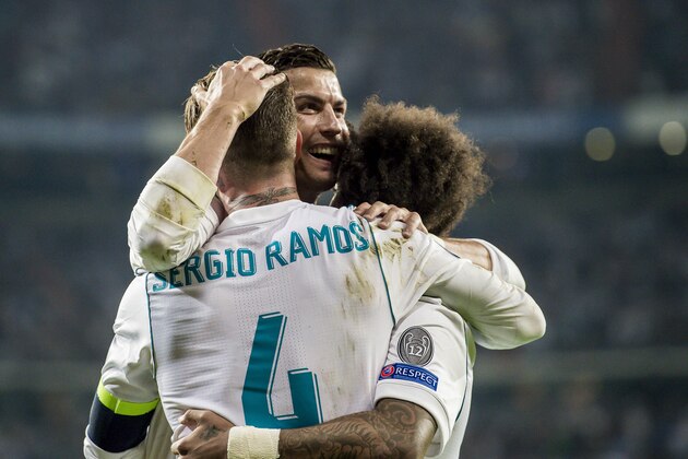 MADRID, SPAIN - SEPTEMBER 13: Sergio Ramos (l) of Real Madrid celebrates with teammates Marcelo Vieira Da Silva (r) and Cristiano Ronaldo during the UEFA Champions League 2017-18 match between Real Madrid and APOEL FC at Estadio Santiago Bernabeu on 13 September 2017 in Madrid, Spain. (Photo by Power Sport Images/Getty Images)