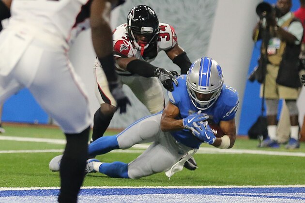 DETROIT, MI - SEPTEMBER 24:  Golden Tate #15 of the Detroit Lions catches the ball as Brian Poole #34 of the Atlanta Falcons touches him and his knee hits the ground during the fourth quarter at Ford Field on September 24, 2017 in Detroit, Michigan. The play war originally ruled a touchdown but was overturned after the officials viewed the play and the game was over giving the Atlanta Falcons a 30-26 victory over the Detroit Lions. (Photo by Rey Del Rio/Getty Images)