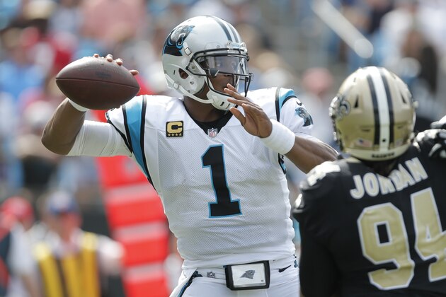 Carolina Panthers' Cam Newton (1) looks to pass against the New Orleans Saints in the second half of an NFL football game in Charlotte, N.C., Sunday, Sept. 24, 2017. (AP Photo/Bob Leverone)