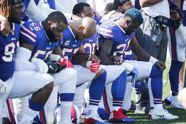 ORCHARD PARK, NY - SEPTEMBER 24:  Buffalo Bills players kneel during the American National anthem before an NFL game against the Denver Broncos on September 24, 2017 at New Era Field in Orchard Park, New York.  (Photo by Brett Carlsen/Getty Images)