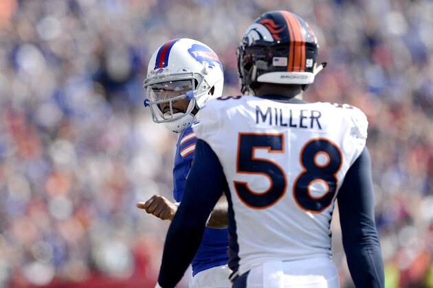 Buffalo Bills quarterback Tyrod Taylor, left, talks to Denver Broncos outside linebacker Von Miller (58) during the second half of an NFL football game, Sunday, Sept. 24, 2017, in Orchard Park, N.Y. (AP Photo/Adrian Kraus)