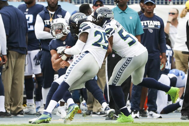 NASHVILLE, TN - SEPTEMBER 24:  Quarterback Marcus Mariota #8 of the Tennessee Titans is hit by Cornerback Richard Sherman #25 of the Seattle Seahawks at Nissan Stadium on September 24, 2017 in Nashville, Tennessee. (Photo by Shaban Athuman/Getty Images)