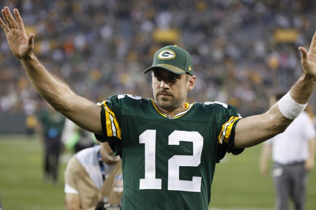Green Bay Packers' Aaron Rodgers celebrates after an NFL football game against the Cincinnati Bengals Sunday, Sept. 24, 2017, in Green Bay, Wis. The Packers won 27-24 in overtime. (AP Photo/Mike Roemer)