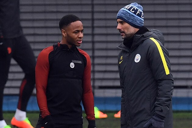Manchester City's English forward Raheem Sterling (L) speaks to Manchester City's Spanish Manager Pep Guardiola during a training session at the City Football Academy in Manchester, north west England, on March 14, 2017, on the eve of their UEFA Champions League Round of 16 second-leg football match against Monaco.  / AFP PHOTO / PAUL ELLIS        (Photo credit should read PAUL ELLIS/AFP/Getty Images)