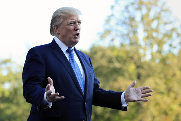President Donald Trump speaks to reporters upon his return to the White House in Washington, Sunday, Sept. 24, 2017. Citizens of eight countries will face new restrictions on entry to the U.S. under a proclamation signed by Trump on Sunday. (AP Photo/Manuel Balce Ceneta)