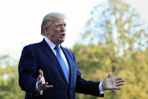 President Donald Trump speaks to reporters upon his return to the White House in Washington, Sunday, Sept. 24, 2017. Citizens of eight countries will face new restrictions on entry to the U.S. under a proclamation signed by Trump on Sunday. (AP Photo/Manuel Balce Ceneta)