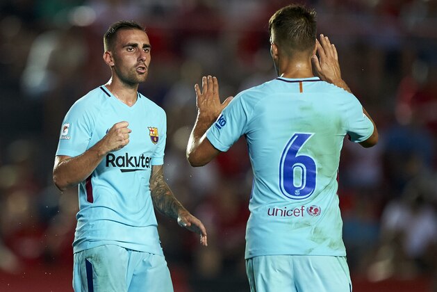 TARRAGONA, SPAIN - AUGUST 04:  Paco Alcacer (L) of Barcelona celebrates with Denis Suarez of Barcelona (R) after scoring a goal during the pre-season friendly match between Gimnastic de Tarragona and FC Barcelona at Nou Estadi de Tarragona on August 4, 2017 in Tarragona, Spain.  (Photo by fotopress/Getty Images)