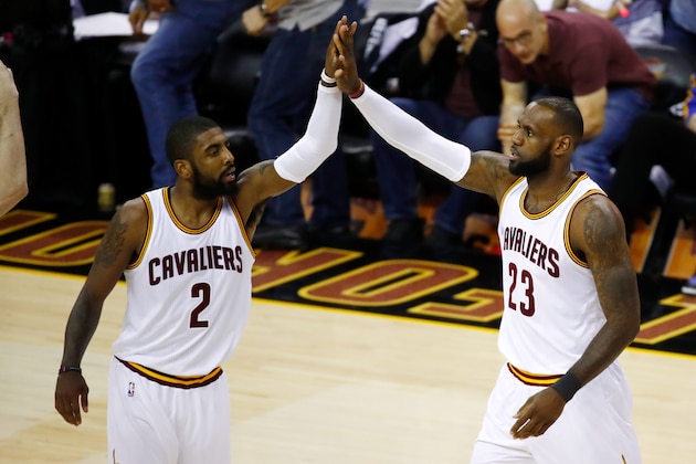 CLEVELAND, OH - JUNE 09: Kyrie Irving #2 and LeBron James #23 of the Cleveland Cavaliers high five against the Golden State Warriors in Game 4 of the 2017 NBA Finals at Quicken Loans Arena on June 9, 2017 in Cleveland, Ohio. NOTE TO USER: User expressly acknowledges and agrees that, by downloading and or using this photograph, User is consenting to the terms and conditions of the Getty Images License Agreement.  (Photo by Gregory Shamus/Getty Images)