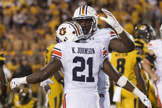 Auburn's Kerryon Johnson (21) celebrates with teammate Mike Horton after Johnson scored a touchdown during the second quarter of an NCAA college football game against Missouri Saturday, Sept. 23, 2017, in Columbia, Mo. (AP Photo/L.G. Patterson)