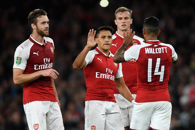 LONDON, ENGLAND - SEPTEMBER 20: Theo Walcott of Arsenal celebrates scoring his sides first goal with his Arsenal team mates during the Carabao Cup Third Round match between Arsenal and Doncaster Rovers at Emirates Stadium on September 20, 2017 in London, England.  (Photo by Mike Hewitt/Getty Images)