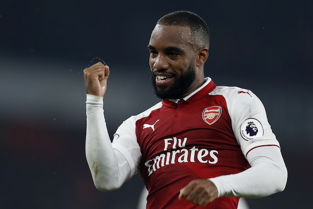 Arsenal's French striker Alexandre Lacazette celebrates scoring his team's second goal from the penalty spot during the English Premier League football match between Arsenal and West Bromwich Albion at the Emirates Stadium in London on September 25, 2017.  / AFP PHOTO / Ian KINGTON / RESTRICTED TO EDITORIAL USE. No use with unauthorized audio, video, data, fixture lists, club/league logos or 'live' services. Online in-match use limited to 75 images, no video emulation. No use in betting, games or single club/league/player publications.  /         (Photo credit should read IAN KINGTON/AFP/Getty Images)
