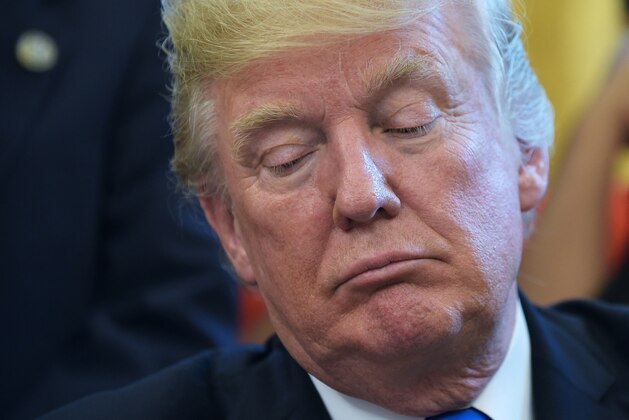 US President Donald Trump is seen during a signing ceremony for a memorandum on increasing access to science, technology, engineering and mathematics education in the Oval Office of the White House on September 25, 2017 in Washington, DC. / AFP PHOTO / MANDEL NGAN        (Photo credit should read MANDEL NGAN/AFP/Getty Images)