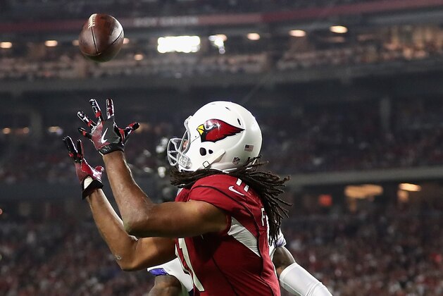 GLENDALE, AZ - SEPTEMBER 25:  Wide receiver Larry Fitzgerald #11 of the Arizona Cardinals catches a 15 yard touchdown pass during the third quarter of the NFL game against the Dallas Cowboys at the University of Phoenix Stadium on September 25, 2017 in Glendale, Arizona.  (Photo by Christian Petersen/Getty Images)