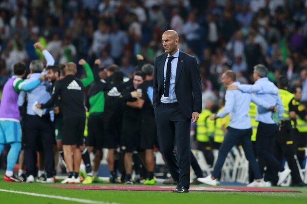 MADRID, SPAIN - SEPTEMBER 20:  Head coach Zinedine Zidane of Real Madrid CF  recats as Real Betis Balompie players celebrate their first goal during the La Liga match between Real Madrid CF and Real Betis Balompie at Estadio Santiago Bernabeu on September 20, 2017 in Madrid, Spain.  (Photo by Gonzalo Arroyo Moreno/Getty Images)