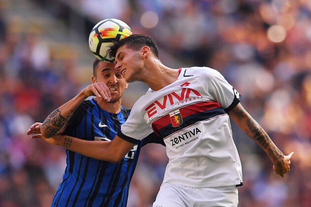 Genoa's forward Pietro Pellegri (R) and Inter Milan's midfielder from Uruguay Matias Vecino go for a header during the Italian Serie A football match Inter Milan vs Genoa at San Siro stadium in Milan on September 24,  2017.   / AFP PHOTO / MARCO BERTORELLO        (Photo credit should read MARCO BERTORELLO/AFP/Getty Images)