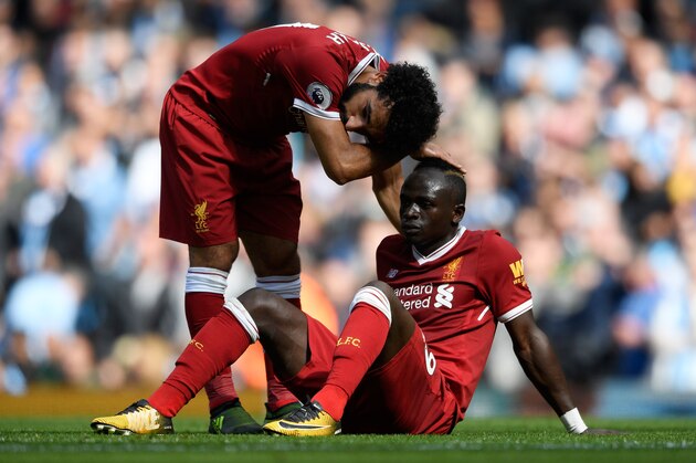 MANCHESTER, ENGLAND - SEPTEMBER 09: Mohamed Salah of Liverpool comforts Sadio Mane of Liverpool after he reacts to being sent off during the Premier League match between Manchester City and Liverpool at Etihad Stadium on September 9, 2017 in Manchester, England.  (Photo by Stu Forster/Getty Images)