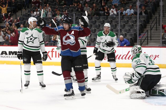 Colorado Avalanche center Matt Duchene celebrates goal by teammate Sergei Boikov against Dallas Stars goalie Kari Lehtonen (32) during the first period of a preseason NHL hockey game Thursday, Sept. 21, 2017, in Denver. (AP Photo/Jack Dempsey)