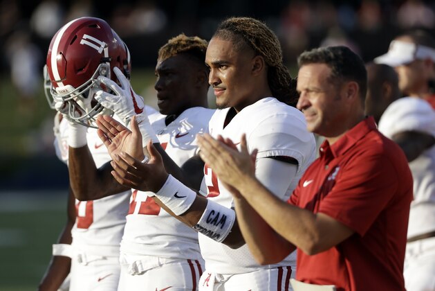 Alabama quarterback Jalen Hurts, second from right, cheers his teammates in the second half of an NCAA college football game against Vanderbilt Saturday, Sept. 23, 2017, in Nashville, Tenn. (AP Photo/Mark Humphrey)