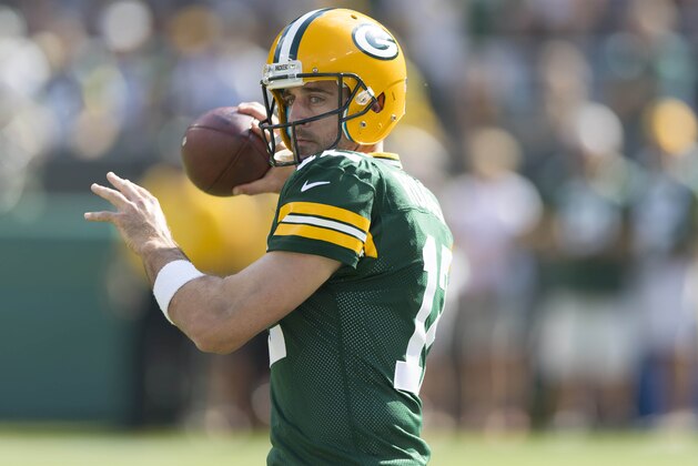 Sep 24, 2017; Green Bay, WI, USA; Green Bay Packers quarterback Aaron Rodgers (12) throws a pass during warmups prior to the game against the Cincinnati Bengals at Lambeau Field. Mandatory Credit: Jeff Hanisch-USA TODAY Sports