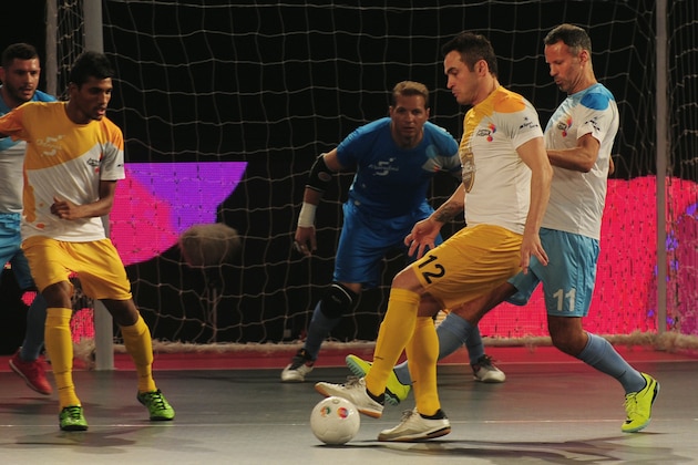 Alessandro Rosa Viera (2R), also known as Falcao, from the Chennai 5's plays against the Mumbai 5's during their Premier Futsal Football League match in Chennai on July 15, 2016. / AFP PHOTO / ARUN SANKAR        (Photo credit should read ARUN SANKAR/AFP/Getty Images)